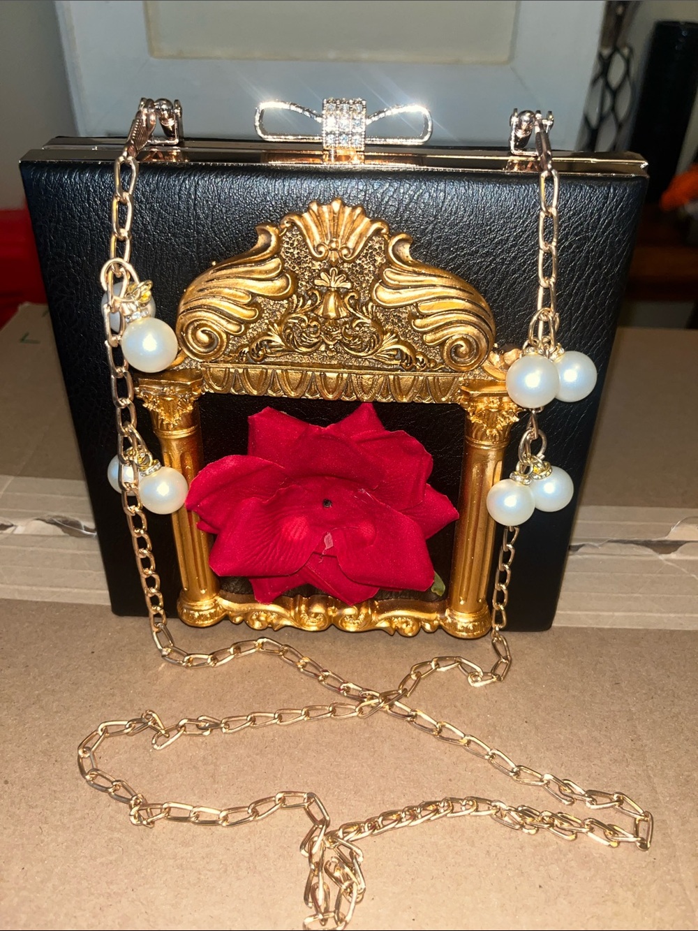 NWOT Elegant Black Box Clutch with Gold Frame & Red Flower Accent